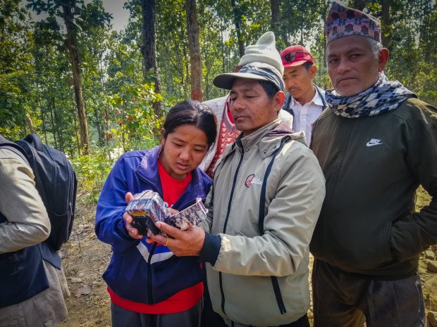 Community members checking out camera traps